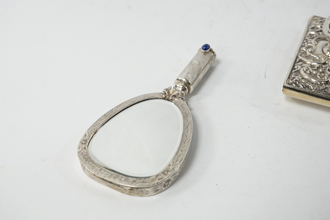 An early to mid 20th century continental white metal mounted combination compact and lipstick holder?, 14.2cm, together with an Edwardian repousse silver mounted blotter. Condition - poor to fair